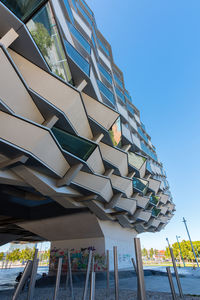 Low angle view of building against clear blue sky