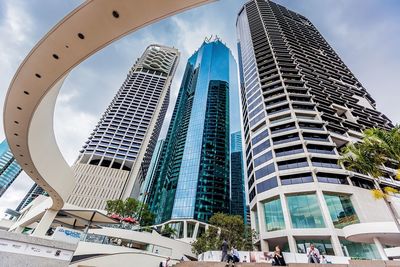 Low angle view of modern buildings against sky in city