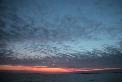 Scenic view of sea against dramatic sky