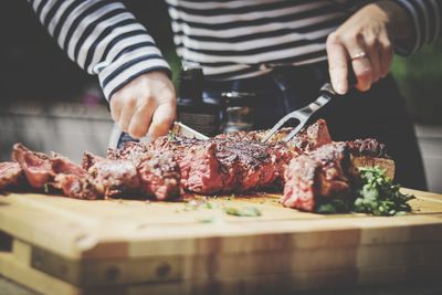 Midsection of man preparing food