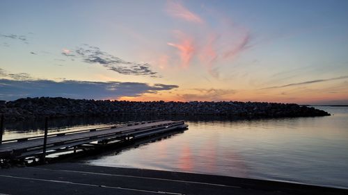 Scenic view of lake against sky during sunset