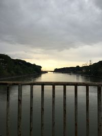 Scenic view of lake against sky at sunset