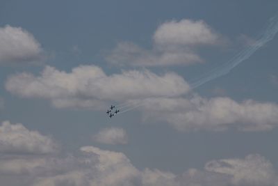 Low angle view of airplane flying in sky