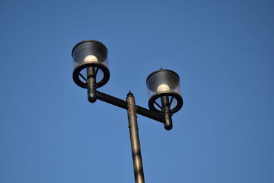 Low angle view of street light against sky