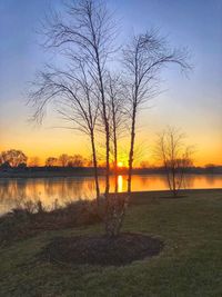 Scenic view of lake against sky during sunset