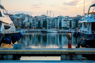 Boats moored with buildings in background