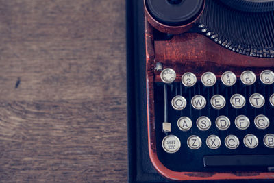 High angle view of old telephone on table