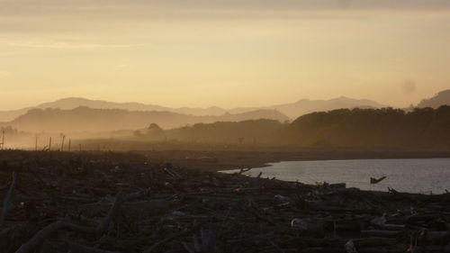 Scenic view of mountains against sky during sunset