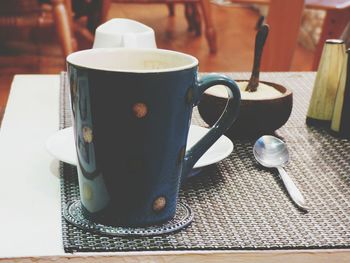 Close-up of coffee cup on table