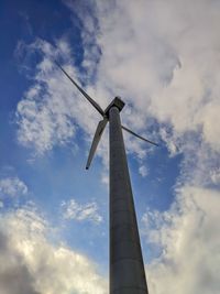 Low angle view of windmill against sky