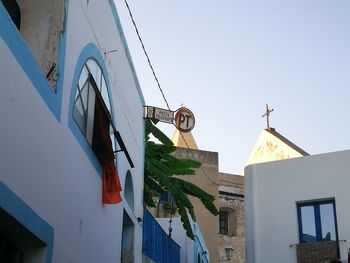 Low angle view of buildings against clear sky