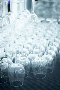 High angle view of upside down wineglasses on table