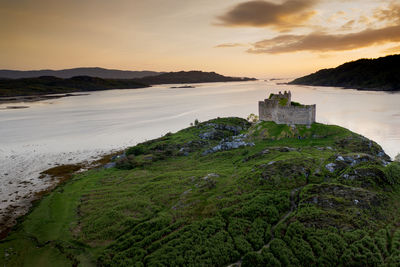 Scenic view of sea against sky during sunset
