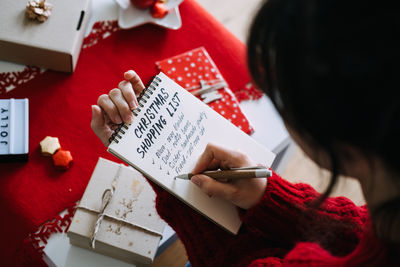 Midsection of woman using digital tablet
