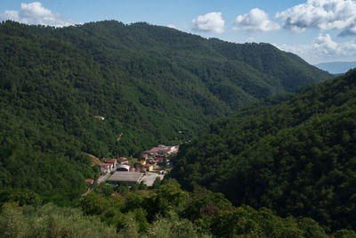 High angle view of trees and mountains against sky