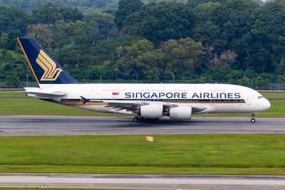 View of airplane at airport runway