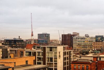 Buildings in city against sky