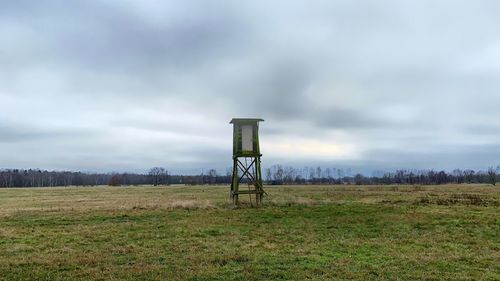 Built structure on field against sky