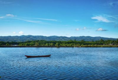 Boats in calm lake