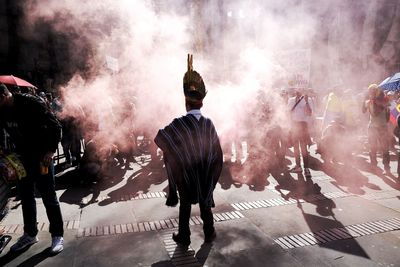 People enjoying music concert in city