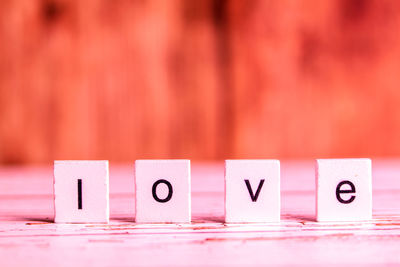 Close-up of love text with blocks on table