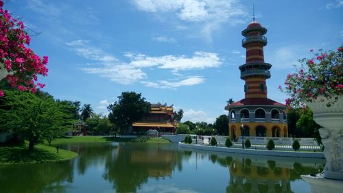 Summer palace reflecting on chao phraya river against sky
