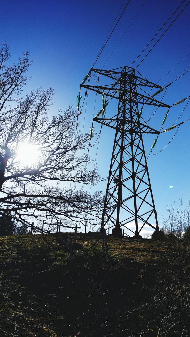 low angle view, sky, electricity, no people, power line, electricity pylon, power supply, outdoors, day, connection, nature, tree