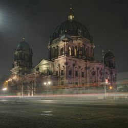 Illuminated cathedral against sky at night