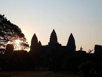 Silhouette of temple against clear sky