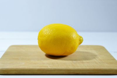 Close-up of lemon slice on white background