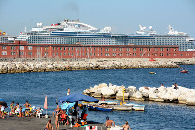 Group of people on boats in sea