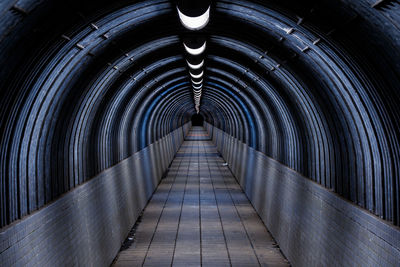 Empty footbridge in tunnel