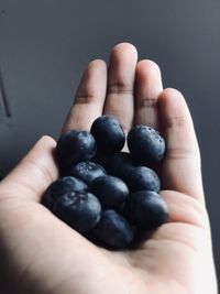 Close-up of hand holding fruit