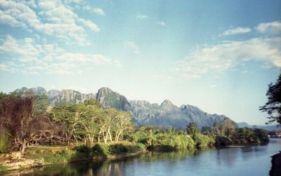 Scenic view of lake and mountains against sky