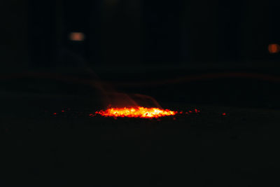 Close-up of illuminated fire in the dark