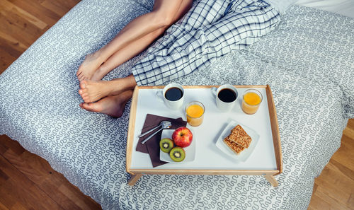 High angle view of woman having breakfast at home