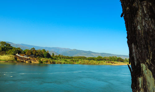 Scenic view of sea against clear blue sky