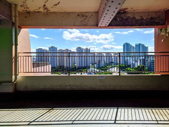 Buildings against sky seen from balcony