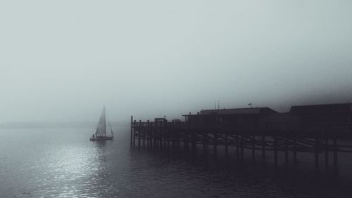 Scenic view of sea against sky during foggy weather