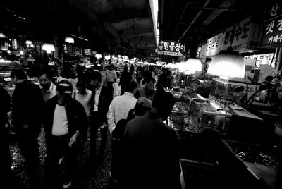 Crowd at market in city at night