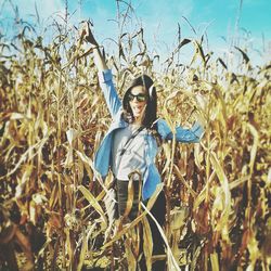 Woman standing on grassy field