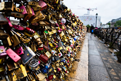 Padlocks on railing of bridge