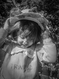 Close-up of cute smiling girl wearing sun hat