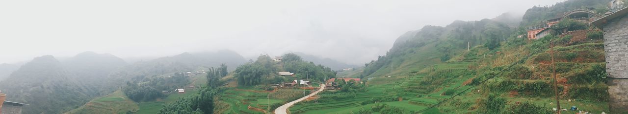 Panoramic view of mountains against sky during foggy weather