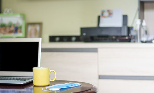 Coffee cup on table at home