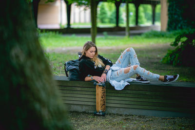 Portrait of woman sitting on bench