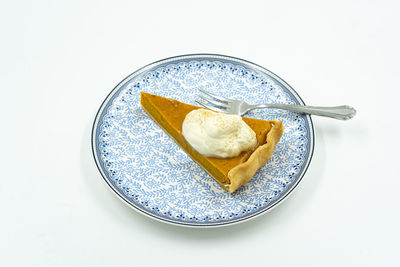 High angle view of food in plate on white background