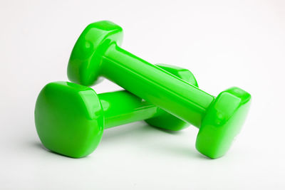 Close-up of green toy against white background