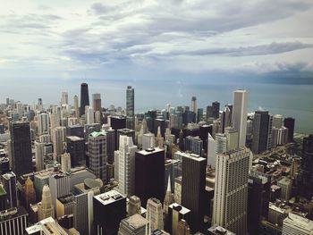 Aerial view of modern buildings in city against sky