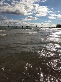 Scenic view of sea against cloudy sky